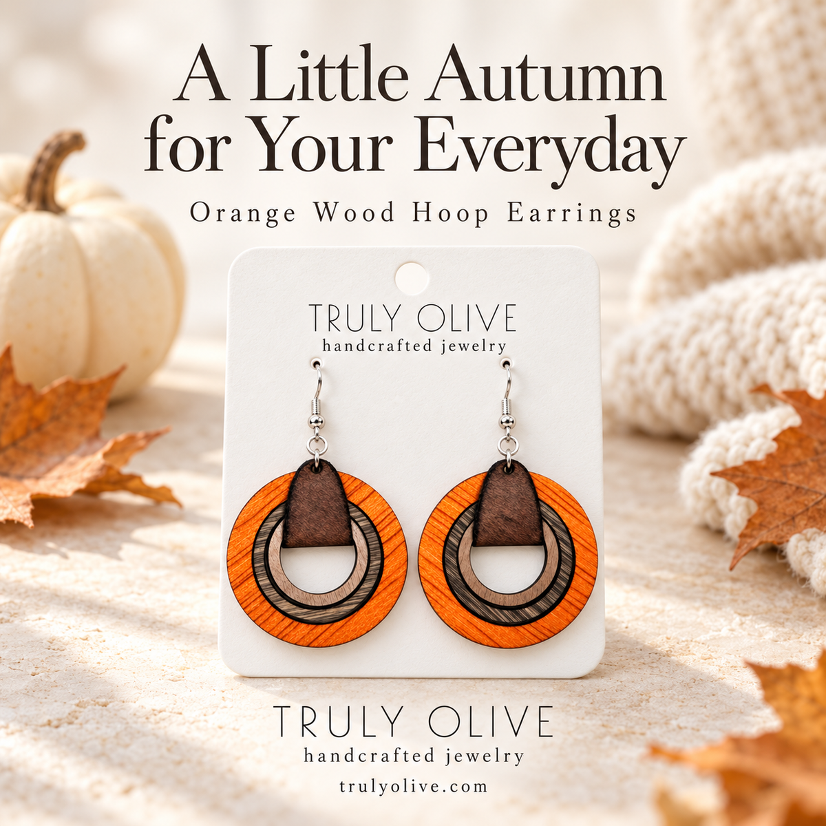 Orange wood hoop earrings with Truly Olive branding and the headline “A Little Autumn for Your Everyday.”