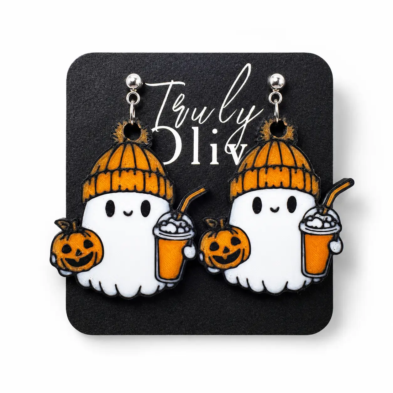 Handcrafted cozy ghost Halloween dangle earrings featuring white ghosts in orange knit hats holding jack-o’-lanterns and festive fall drinks, displayed on a black Truly Olive card against a clean white background.