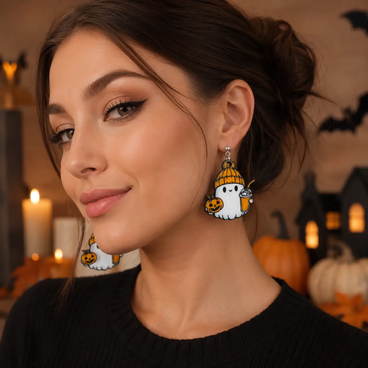 Woman wearing cute ghost Halloween dangle earrings with orange hats, pumpkin details, and fall drinks in a warm seasonal setting with pumpkins and autumn décor.