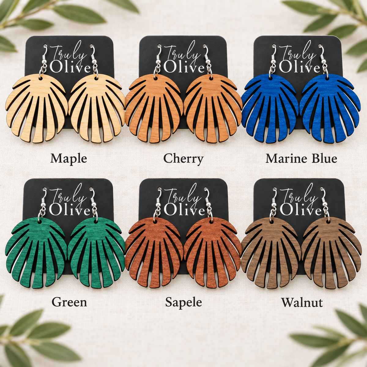 Six pairs of split-leaf earrings labeled Maple, Cherry, Marine Blue, Green, Sapele, and Walnut.