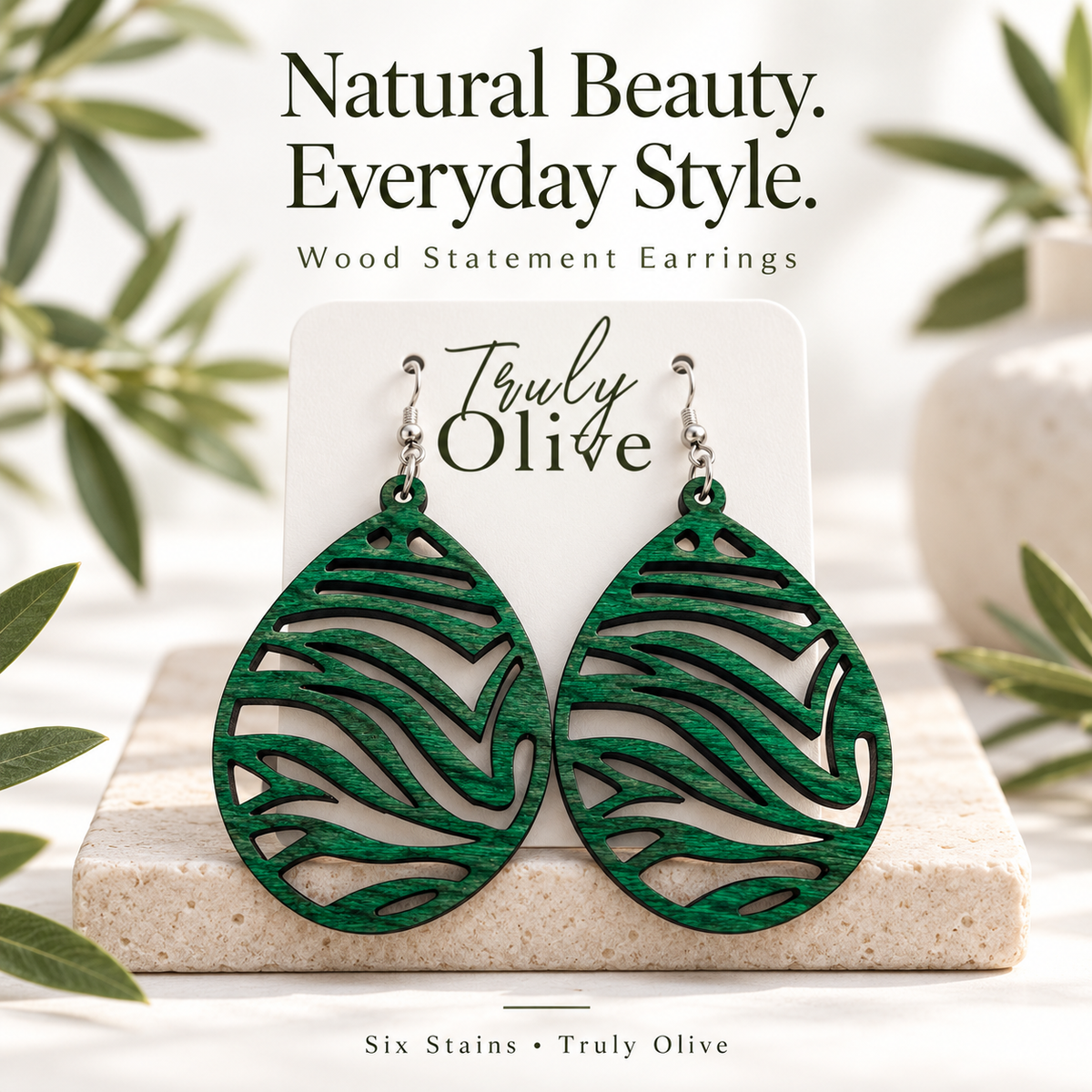 Green wood earrings beneath “Natural Beauty. Everyday Style.” text, with a “Six Stains • Truly Olive” footer.