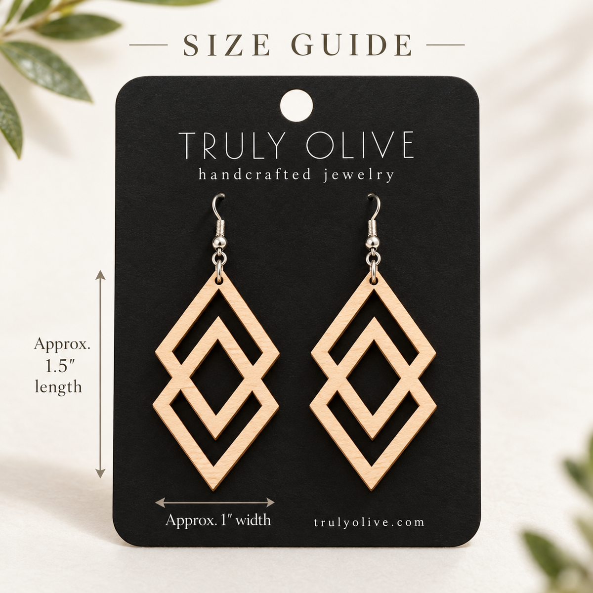 Maple Connected Diamond wood earrings on a black Truly Olive card with approximate measurements of 1.5 inches long and 1 inch wide.
