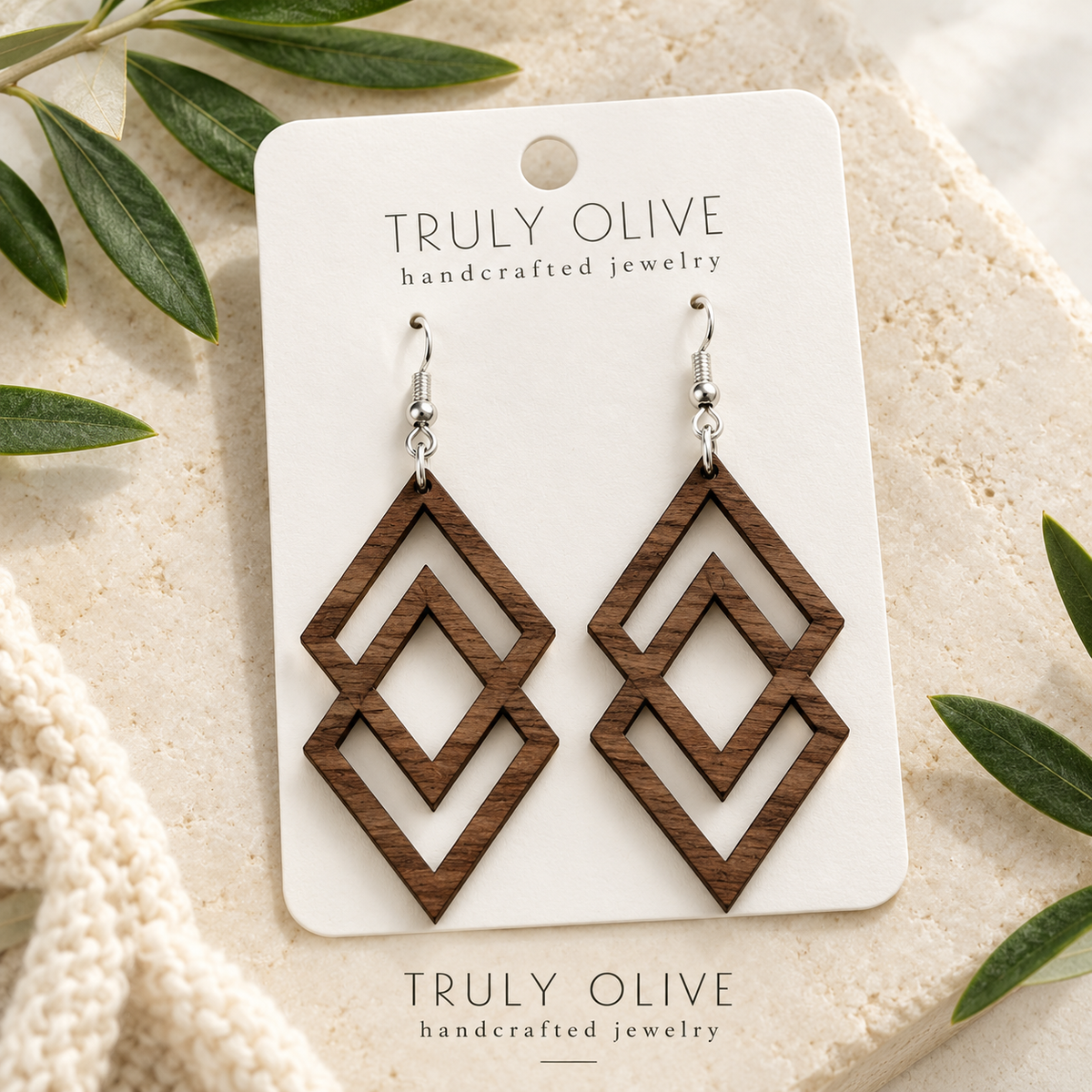 Walnut Connected Diamond wood earrings arranged flat with Truly Olive branding.