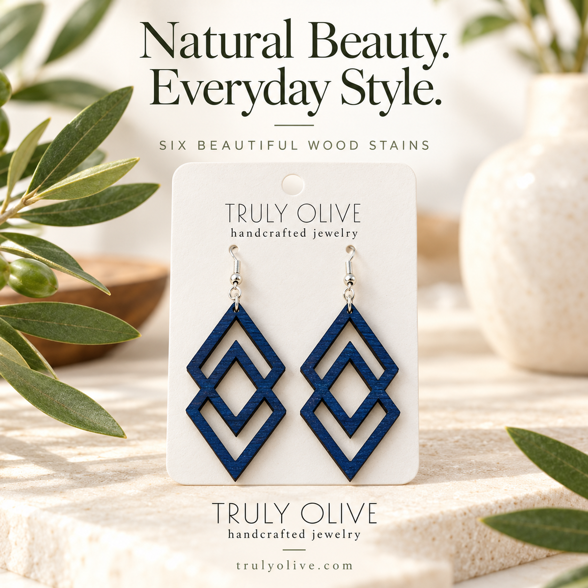 Marine Blue Connected Diamond wood earrings in a styled product image with Truly Olive branding.