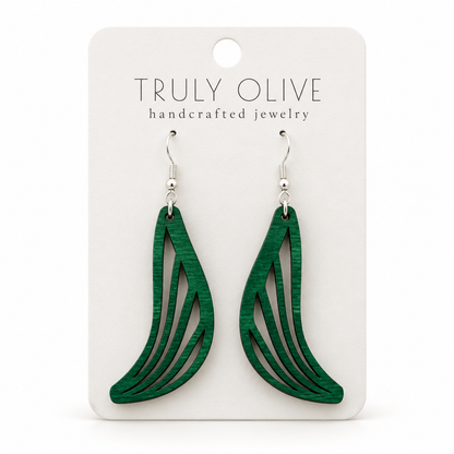 Swept Wing wood earrings in Green stain on a white Truly Olive card.