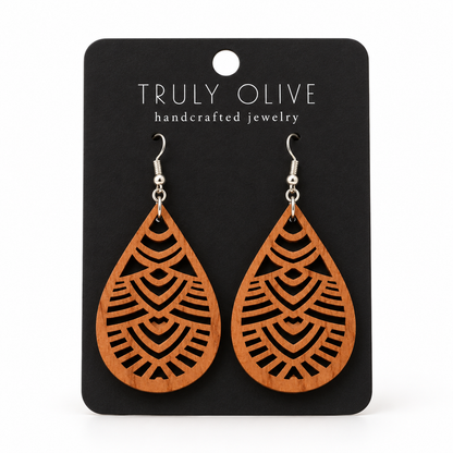 Geometric Teardrop wood earrings in Cherry stain on a black Truly Olive card.