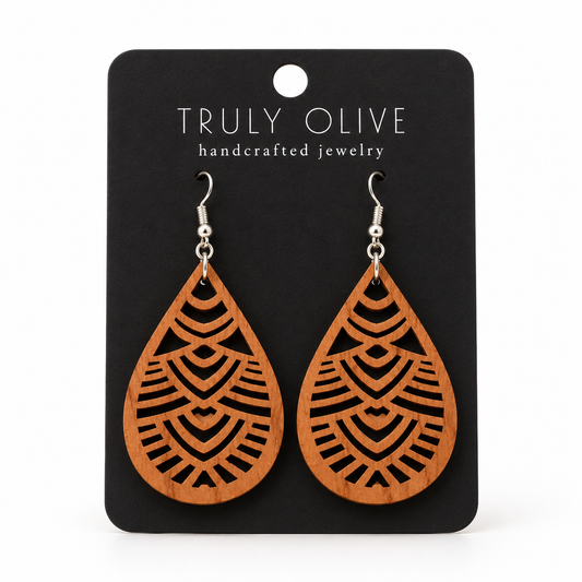 Geometric Teardrop wood earrings in Cherry stain on a black Truly Olive card.