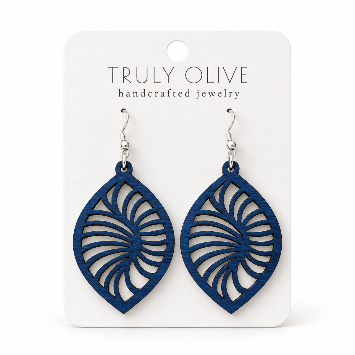 Spiral Leaf wood earrings in Marine Blue stain on a white Truly Olive card.