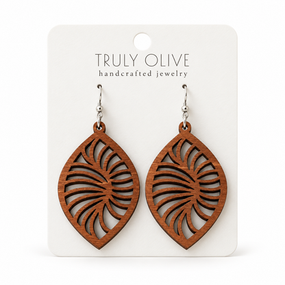 Spiral Leaf wood earrings in Sapele stain on a white Truly Olive card.