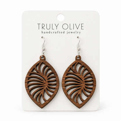 Spiral Leaf wood earrings in Walnut stain on a white Truly Olive card.