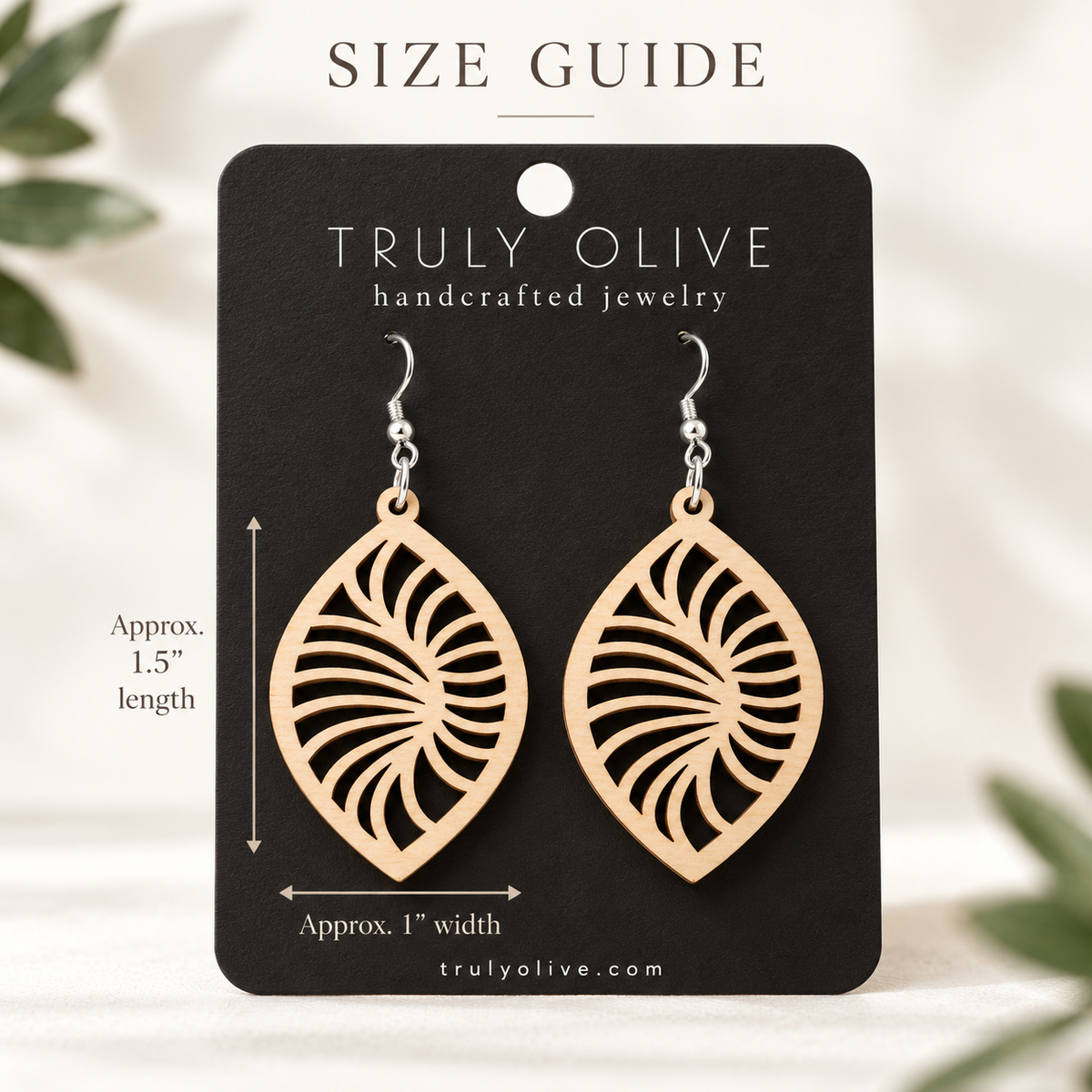 Maple Spiral Leaf wood earrings on a black Truly Olive card with approximate measurements of 1.5 inches long and 1 inch wide.