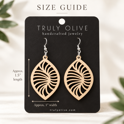 Maple Spiral Leaf wood earrings on a black Truly Olive card with approximate measurements of 1.5 inches long and 1 inch wide.