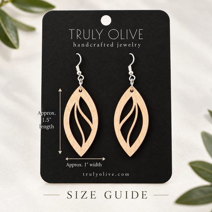 Maple Open Leaf wood earrings on a black Truly Olive card with approximate measurements of 1.5 inches long and 1 inch wide.