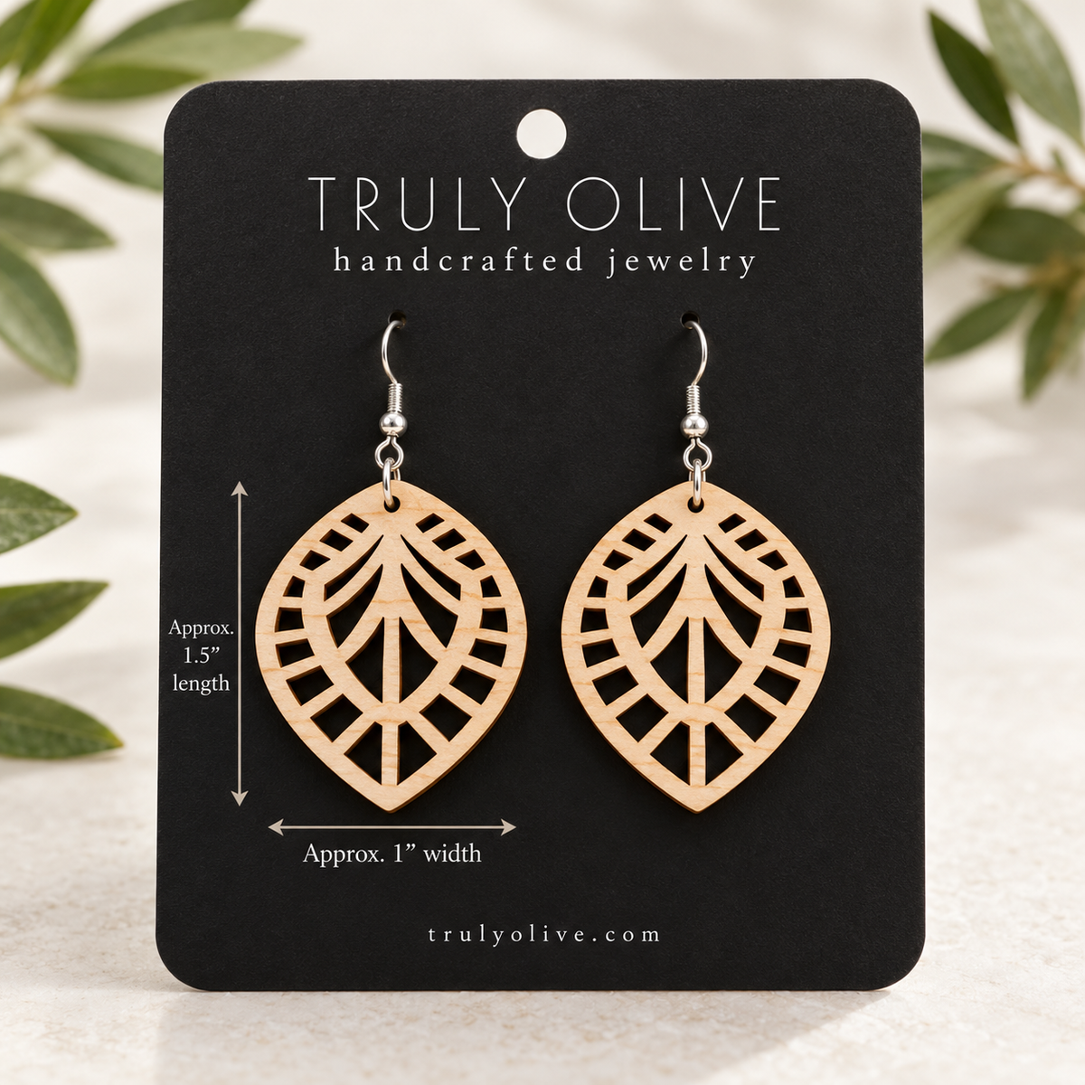 Maple Leaf Lattice wood earrings on a black Truly Olive card with approximate measurements of 1.5 inches long and 1 inch wide.