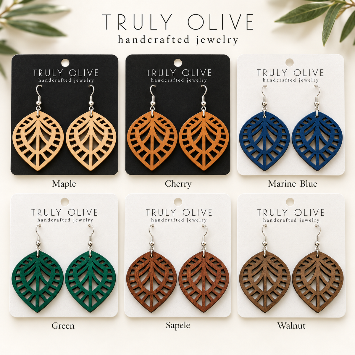 Leaf Lattice wood earrings shown in Maple, Cherry, Marine Blue, Green, Sapele, and Walnut stains on Truly Olive cards.