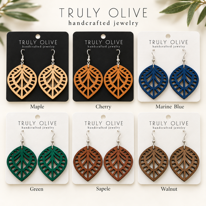 Leaf Lattice wood earrings shown in Maple, Cherry, Marine Blue, Green, Sapele, and Walnut stains on Truly Olive cards.