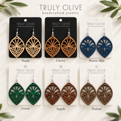 Fan Lattice wood earrings shown in Maple, Cherry, Marine Blue, Green, Sapele, and Walnut stains on Truly Olive cards.