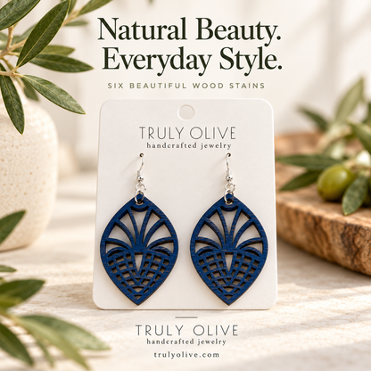 Marine Blue Fan Lattice wood earrings in a styled product image with Truly Olive branding.