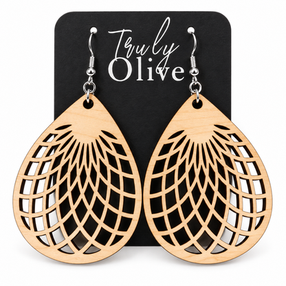 Maple wooden teardrop earrings with geometric cutouts on a black Truly Olive card.