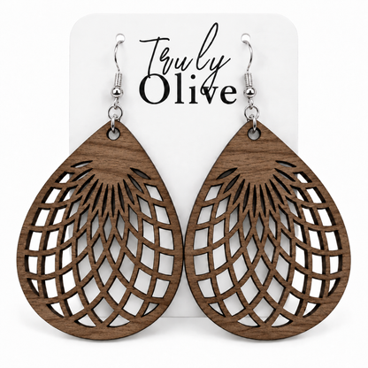 Walnut wooden teardrop earrings with silver hooks on a white Truly Olive card.
