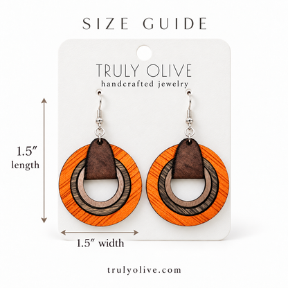 Truly Olive orange wood hoop earrings with measurements labeled 1.5 inches long and 1.5 inches wide.
